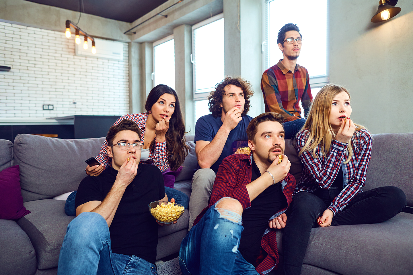 group of people watching TV