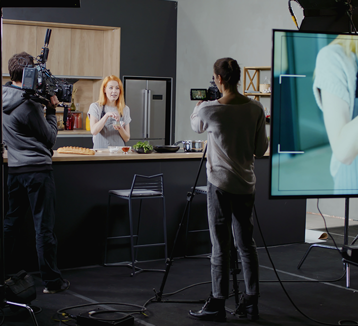 woman being video taped for cooking show