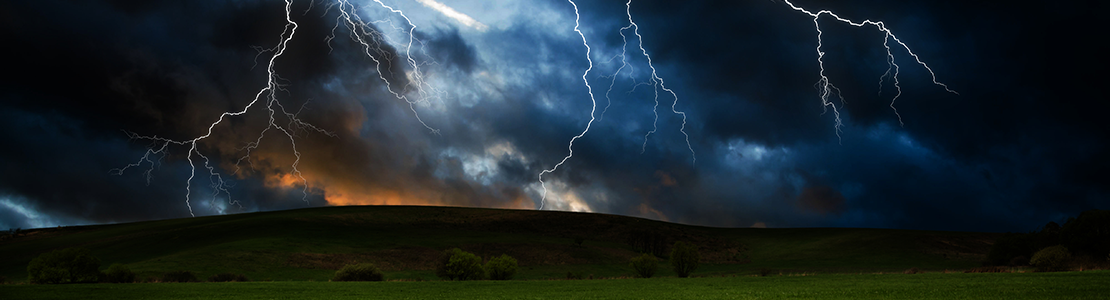 lightning storm over grassy area