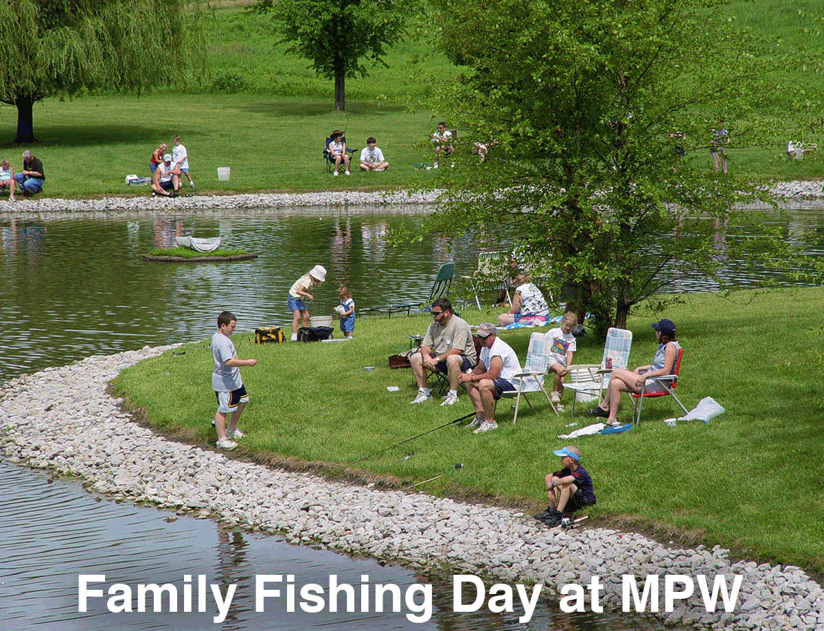 families fishing at pond