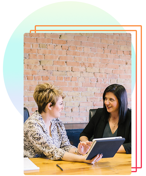 women talking at desk